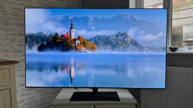 Front view of the LG G6 OLED TV displaying an image of an island in the middle of a lake