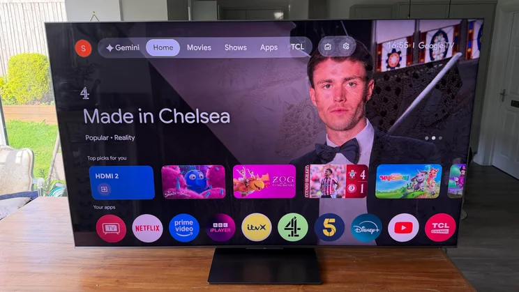 Front view of the TCL C8L SQD Mini LED TV displaying the Google TV homepage