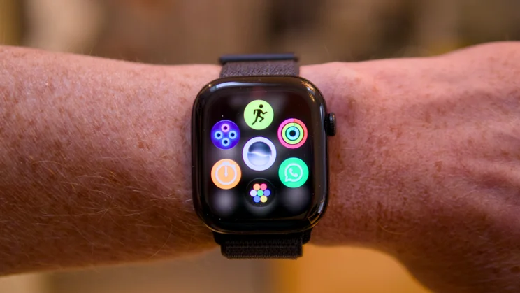 Closer view of an Apple Watch Series 12 on a wrist showing the colourful honeycomb app screen.