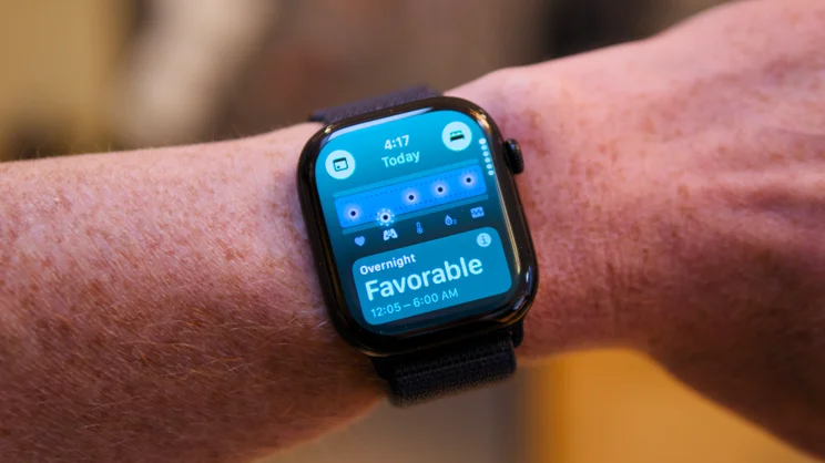 Apple Watch Series 12 on a wrist showing an overnight vitals screen rated Favorable for 12:05 to 6:00 AM.