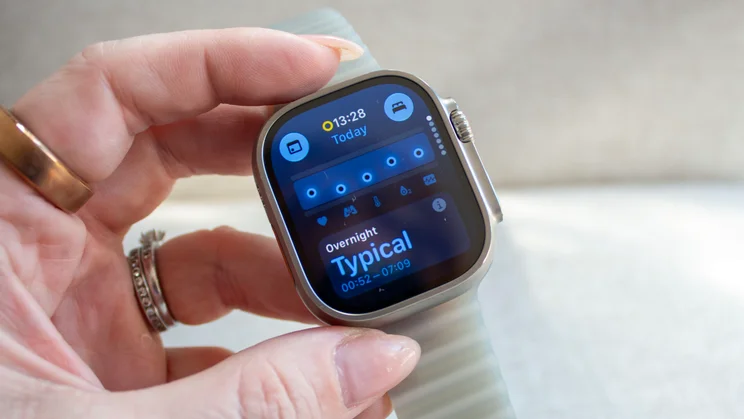 Hand holding the Apple Watch Ultra 4 with the Vitals app screen on display, showing an Overnight reading of Typical