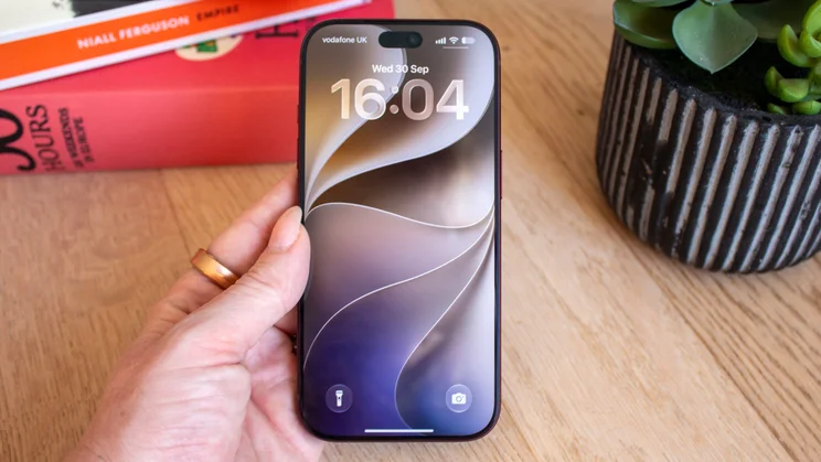 iPhone 18 Pro lock screen displaying the time 16:04 on Wednesday 30 September, with a swirling abstract wallpaper