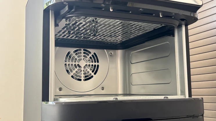 A closeup of the Bosch Series 6 Double Stack Drawer Air Fryer's interior cavity, fan and heating element