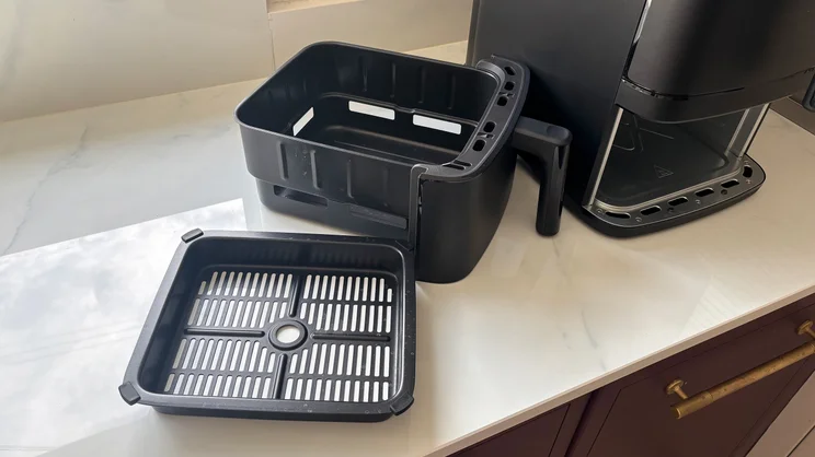 A closeup of the Bosch Series 6 Double Stack Drawer Air Fryer's drawer and crisper plate, removed from the appliance
