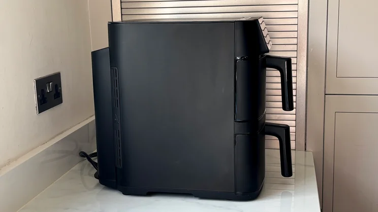 A side view of the Bosch Series 6 Double Stack Drawer Air Fryer on a kitchen worktop