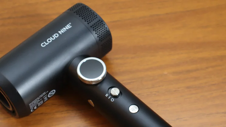 A closeup of the Cloud Nine Airshot Pro Adapt hair dryer's controls