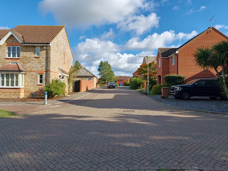 A quiet street with houses on both sides