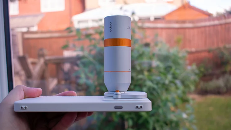 Oppo Find X10 Pro Max with external teleconverter attached, pointing upwards
