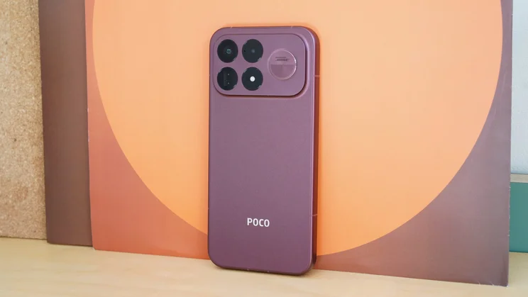 Poco F9 Ultra leaning against a colourful image, rear view