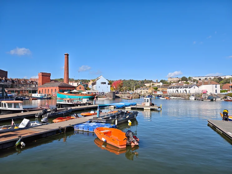 A marina with buildings in the distance