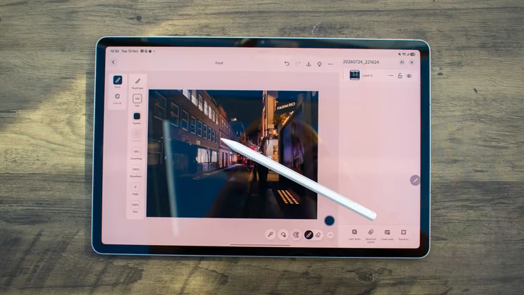 Samsung Galaxy Tab S12 Plus on a table, displaying Photoshop editing an image, S Pen stylus sat on the display
