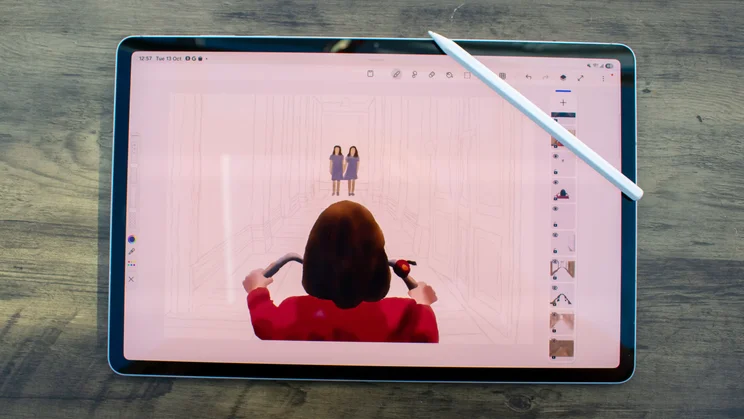 Samsung Galaxy Tab S12 Plus on a table, displaying digital artwork, S Pen stylus on the display