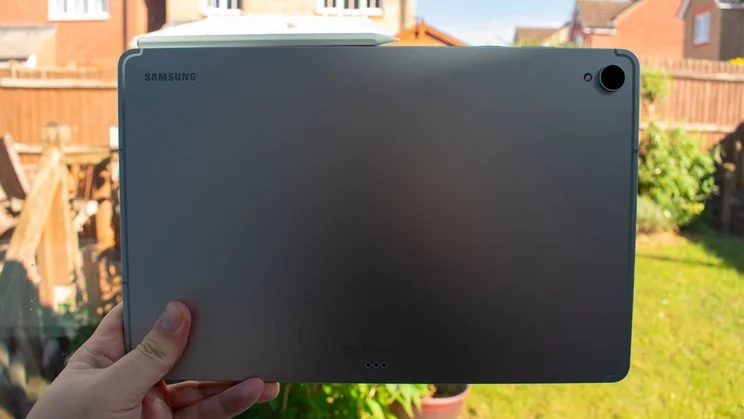 Samsung Galaxy Tab S12 Plus in hand, rear view