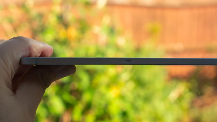 Samsung Galaxy Tab S12 Plus in hand, side view