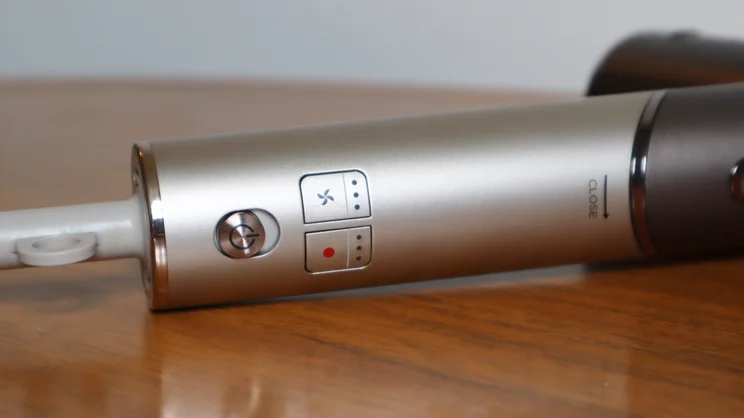 A closeup of the Shark Speedstyle Pro Flex hair dryer's controls