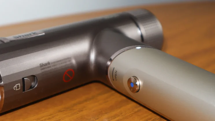 A closeup of the Shark Speedstyle Pro Flex hair dryer's cool shot button