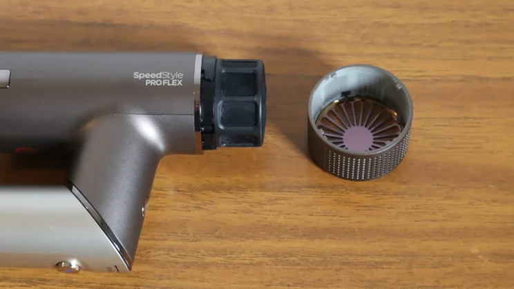 The Shark Speedstyle Pro Flex hair dryer on a wooden table, with filter cover removed