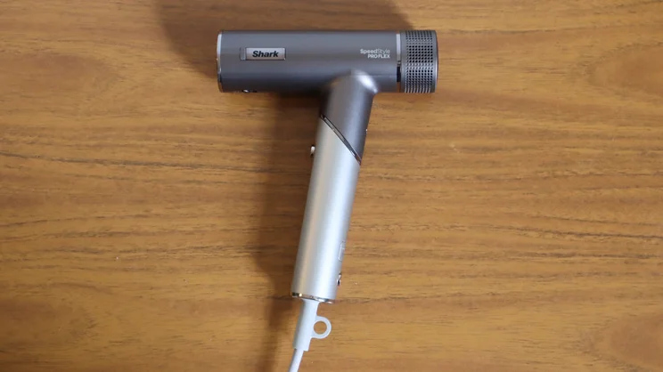 A bird's eye view of the A bird's eye view of the Shark Speedstyle Pro Flex hair dryer on a wooden table