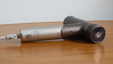 A side view of the A bird's eye view of the Shark Speedstyle Pro Flex hair dryer on a wooden table