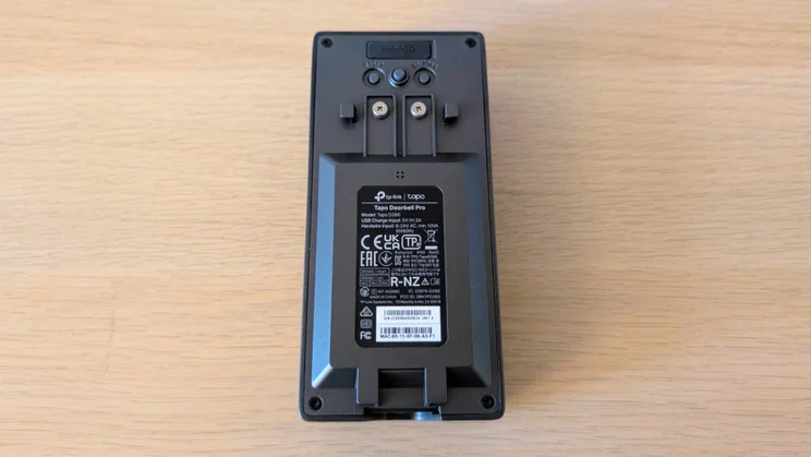 Back of the Tapo D260 Pro doorbell showing the microSD slot, reset and other buttons, two wiring terminal screws and the product label for the Tapo Doorbell Pro, model D260.