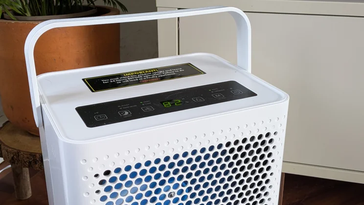 A closeup of the top of the Vonhaus 12l dehumidifier, with handle raised