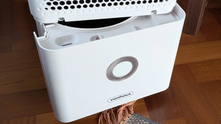 A closeup of the Vonhaus 12l dehumidifier's water tank, partially removed from the unit