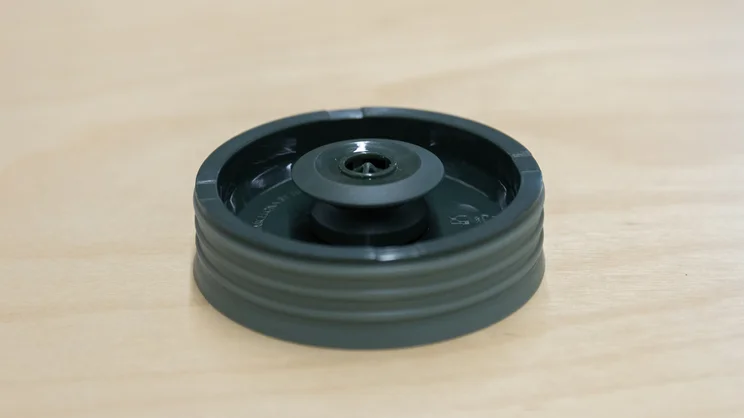 A closeup of the Wacaco Prestina coffee maker's filter, with the 'duck valve' facing upwards