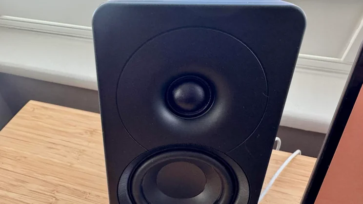 Front close-up focusing on the silk dome tweeter housed within a circular waveguide on a Creative XF1 desktop speaker