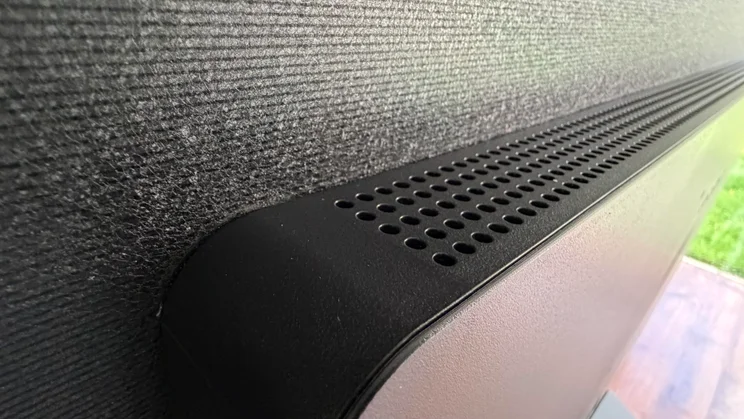 Close-up of the top ventilation grille and textured back casing on the rear housing of the 77in LG C6 OLED featuring Primary RGB Tandem OLED panel technology