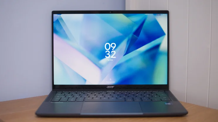 Front view of the Acer Googlebook 14 on a wooden desk, with the lock screen showing the time 09:32 and an Acer logo below the screen.