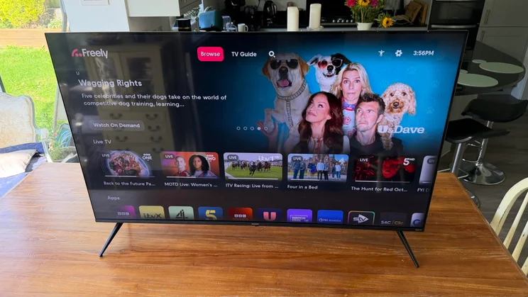 Front angled view of the Sharp HJ6725KB Roku TV showing the Freely streaming interface featuring live TV channels and on-demand content