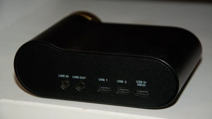 Rear view of the GameHub transmitter unit for the SteelSeries Arctis Nova Elite gaming headset, displaying 3.5mm line in/out ports and three USB-C inputs labelled USB 1, USB 2, and USB 3/Xbox