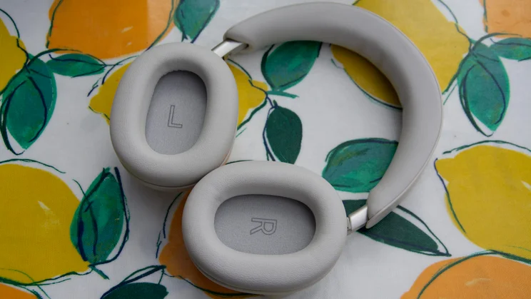 Technics EAH-A1000 headphones laid flat with plush cushioned earpads facing up, displaying visible "L" and "R" driver markings inside each cup